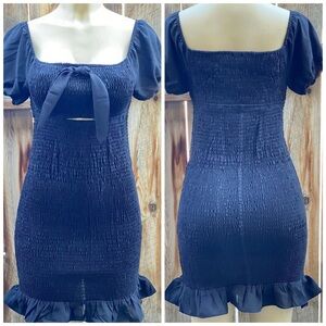 Smocked dress in black available in small, medium and large